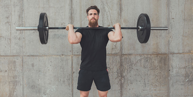 Standing overhead shoulder barbell press